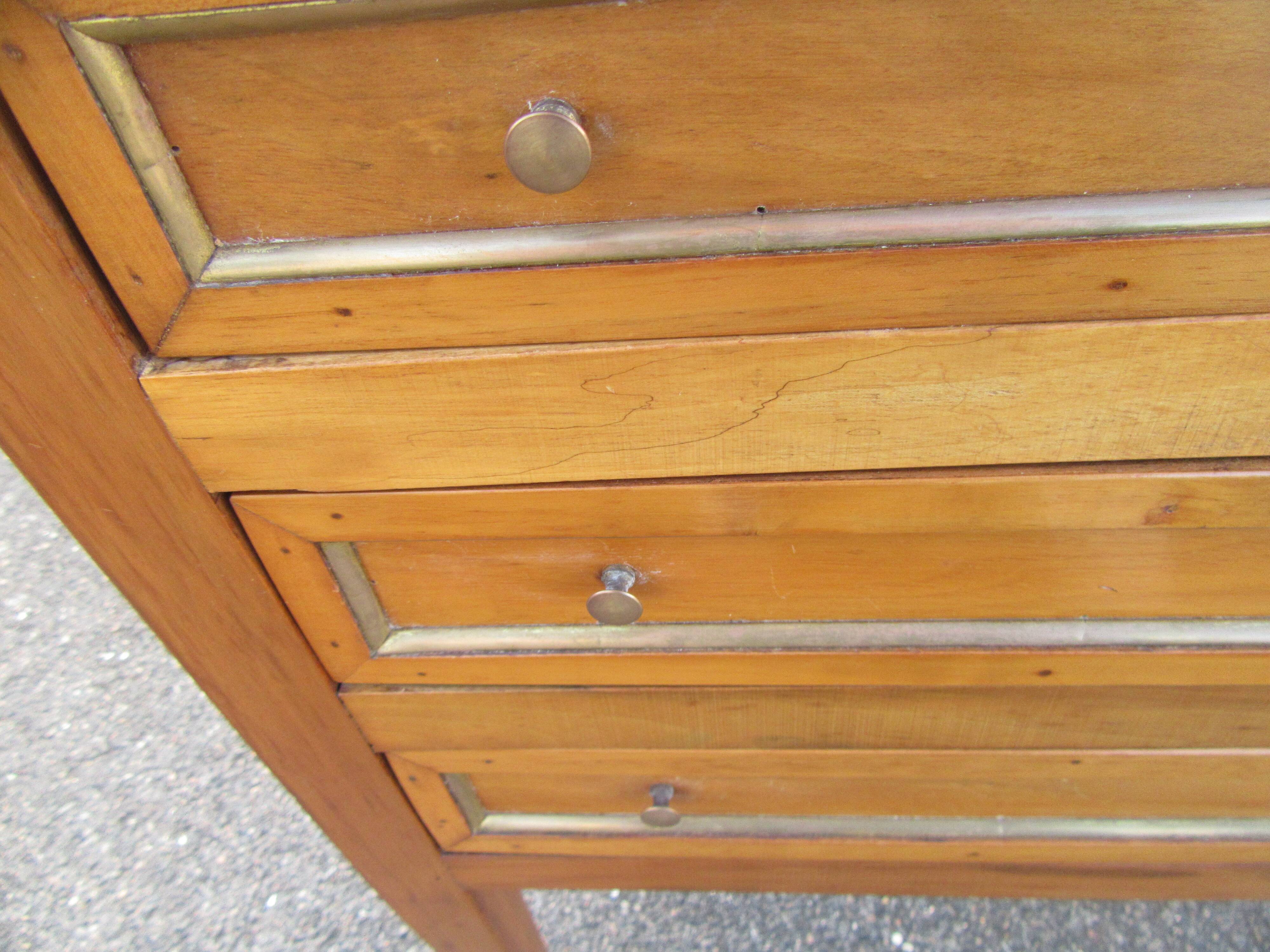 Pair of walnut bedside tables in Louis XVI style with brass inlay.