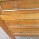 Pair of walnut bedside tables in Louis XVI style with brass inlay.