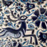Vintage handmade blue ceramic ashtray with deer and flower ornament from Rodos Ceramics.
