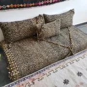 Moroccan sofa on the floor – black and gold pattern