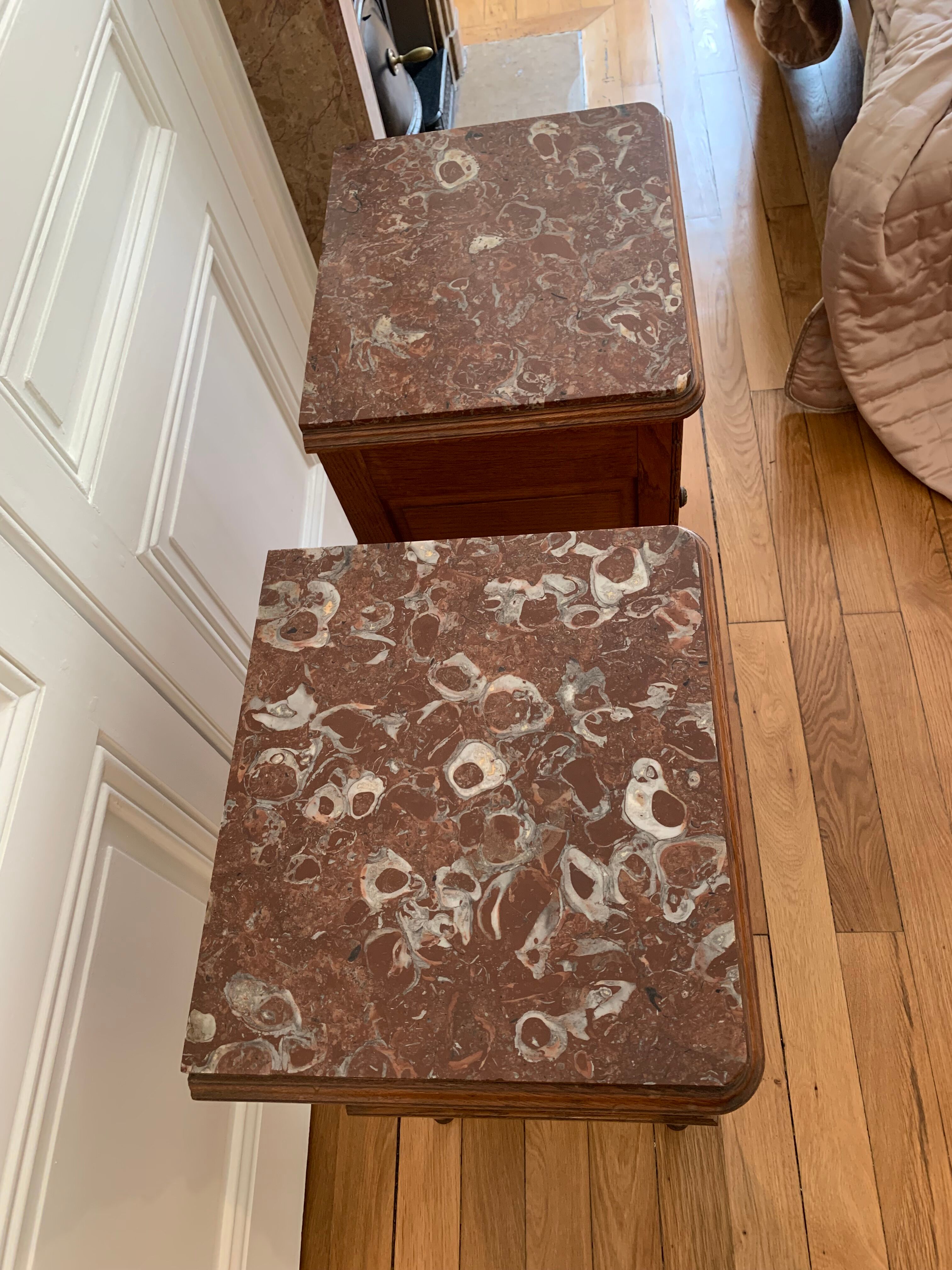 Pair of high marble and walnut bedside tables