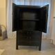 Asian-inspired black lacquered wooden wardrobe