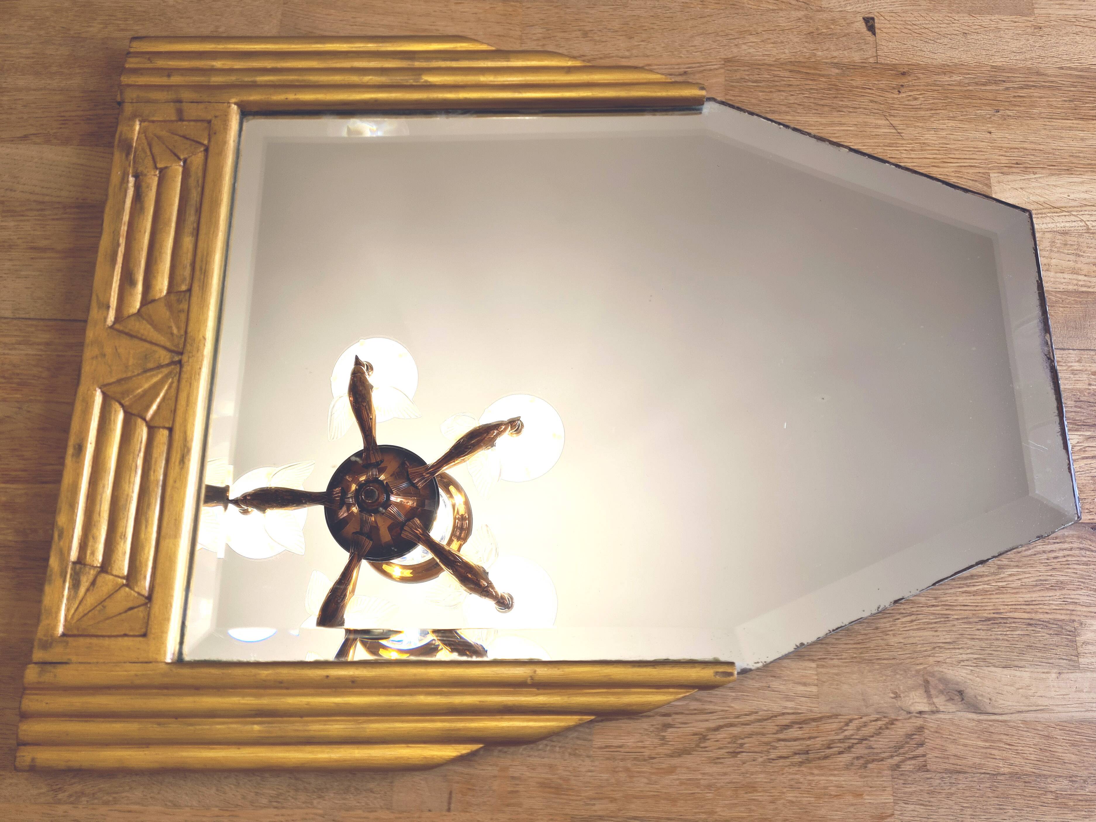 Antique Art Deco mercury mirror, in carved wood with gold leaf.