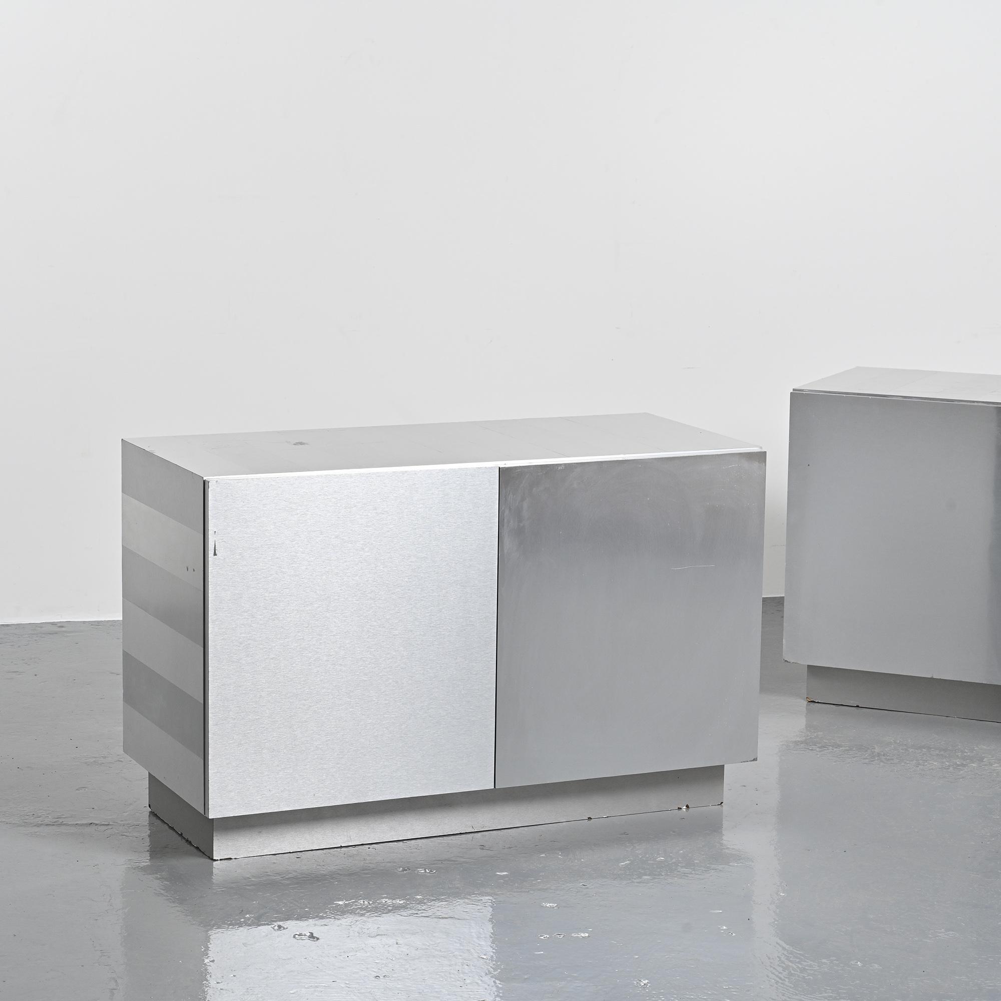 Pair of low buffets in brushed metal, French work, 1970s.