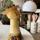 Terracotta plant holder head shape