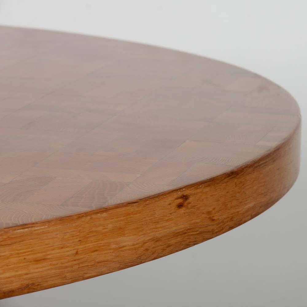 Round wooden dining table from the 1980s.