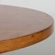 Round wooden dining table from the 1980s.