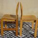 Paire de chaises en bois clair, assise et dossier post formé