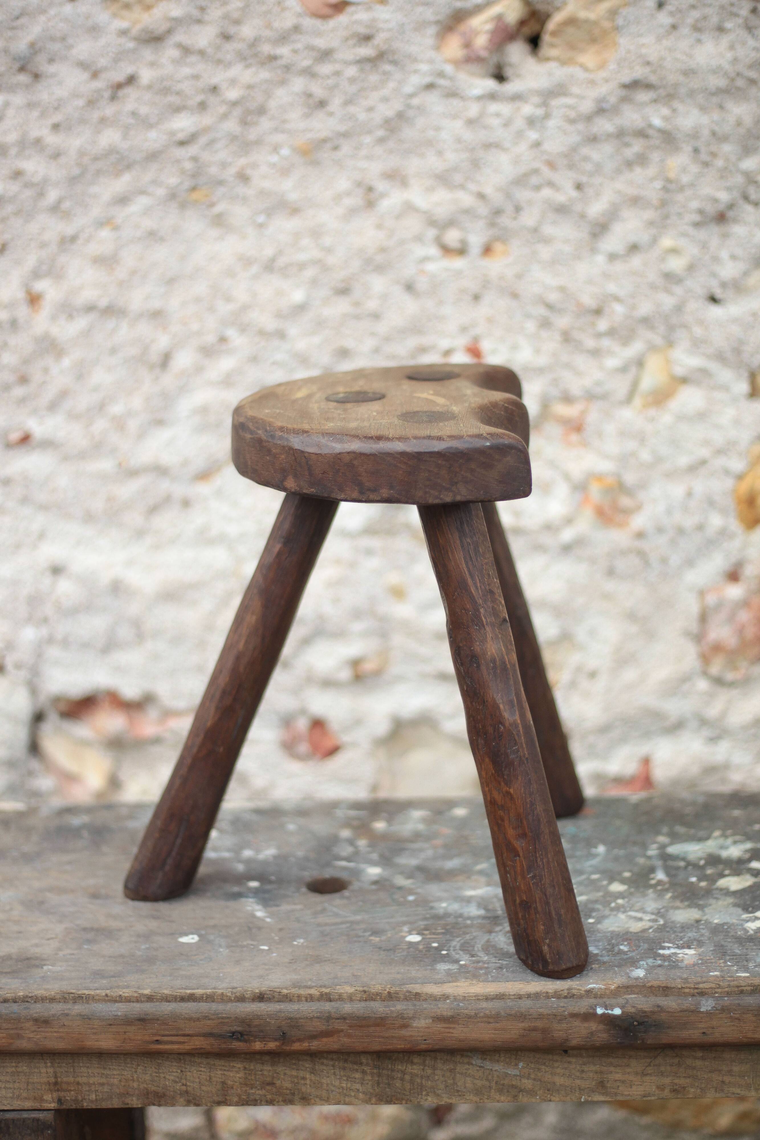 Vintage wooden tripod stool, mountain work, wabi-sabi, shepherd.