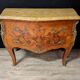 Louis XV style commode with marquetry and its pair of bedside tables.