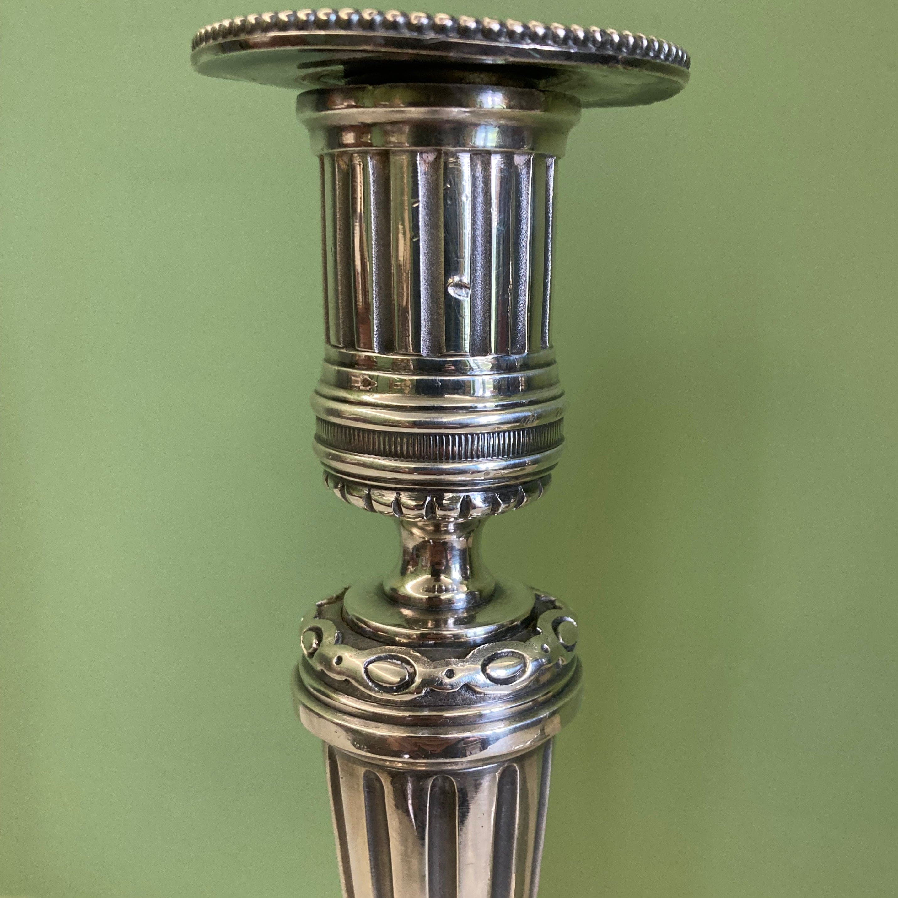 Pair of silvered bronze candlesticks from the 19th century in Louis XVI style signed Voisenet.