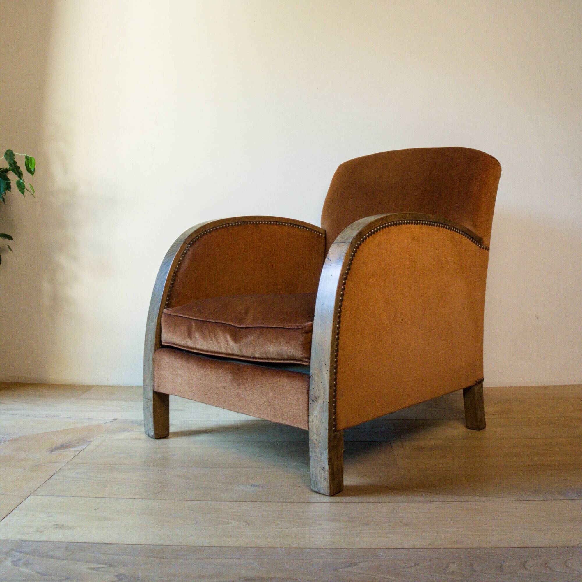 Art Deco club armchair in wood and rust brown velvet, circa 1930.