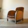 Art Deco club armchair in wood and rust brown velvet, circa 1930.