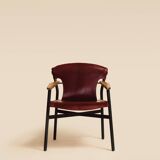 Maërl armchair, Galathée model, red leather, solid wood armrests of your choice
