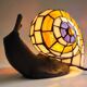 Tiffany-style lamp in the shape of a snail.