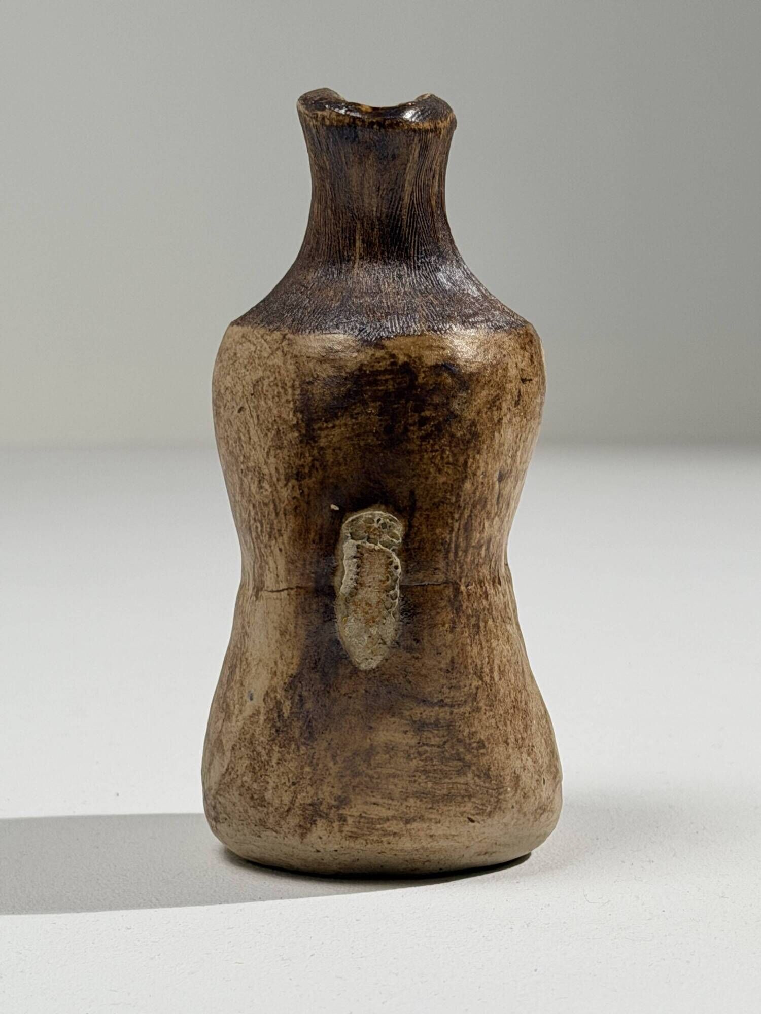 Small brutalist stoneware vase with a ribbed neck, France, circa 1960.