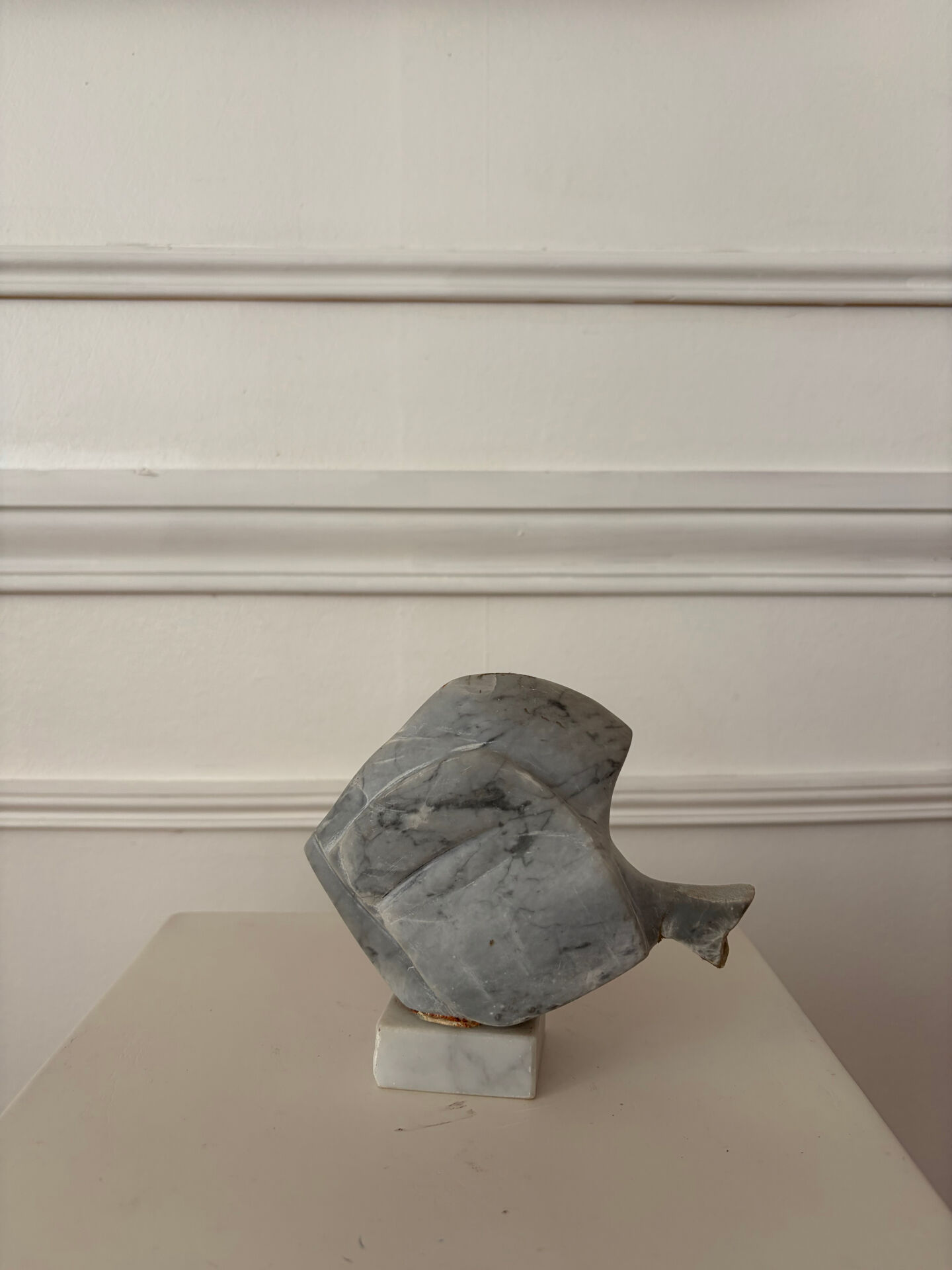 Marble sculpture in the shape of a fish.