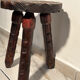 Brutalist sculpted tripod stool in solid wood — 1960s