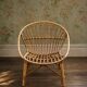 Vintage 1960s rattan shell chair – an icon of bohemian design.