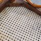 Pair of vintage bistro chairs in curved wood and caning.