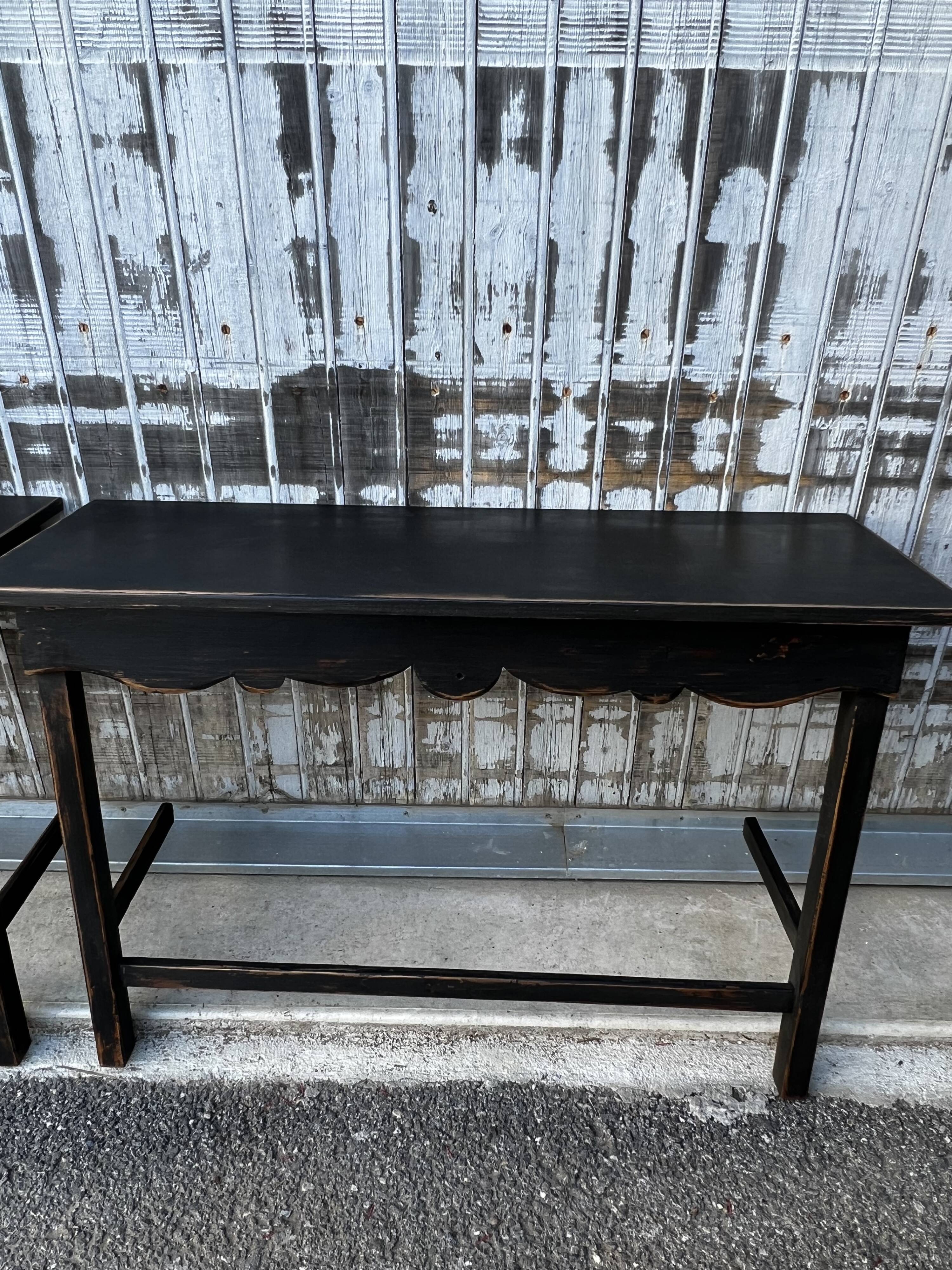 Pair of black patinated consoles