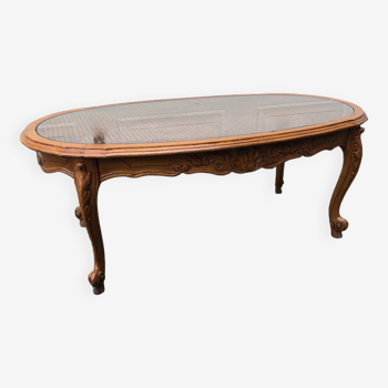 Coffee table with glass top and oval canework