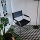 Fauteuil vintage en chrome et simili cuir noir