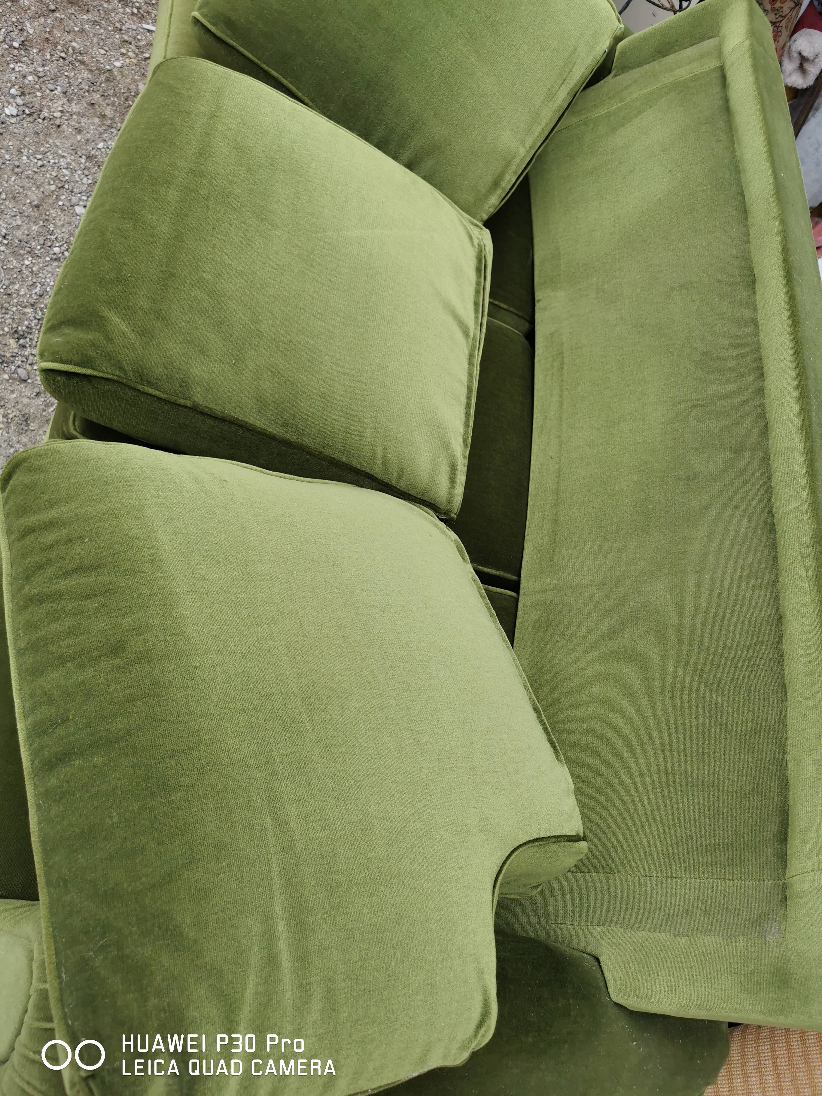 Convertible green velvet sofa