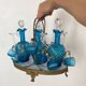 Antique Legras liquor cabinet, decanters and glasses, lion's paw stand