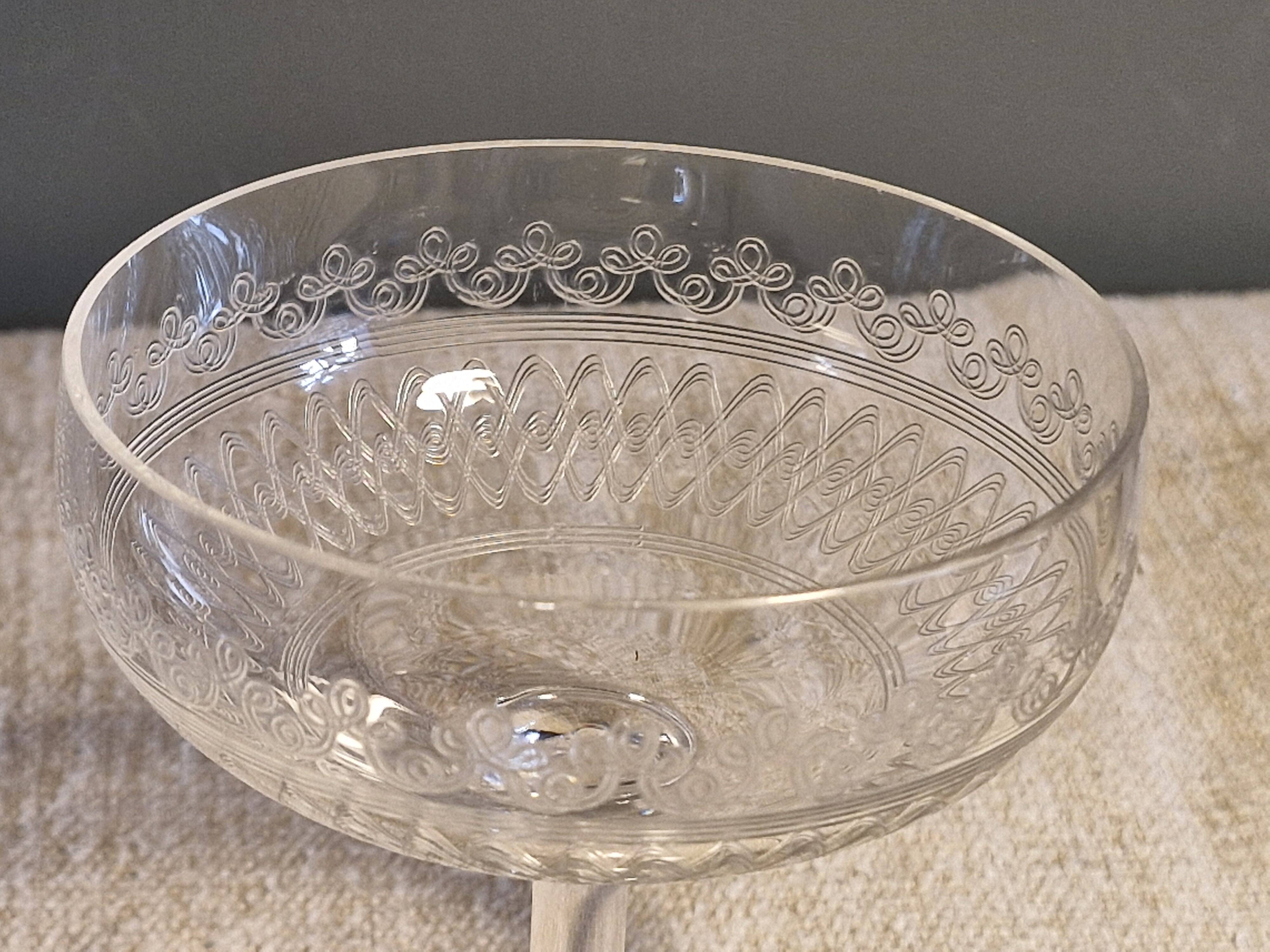 8 antique Baccarat crystal champagne coupes with engraved decoration.