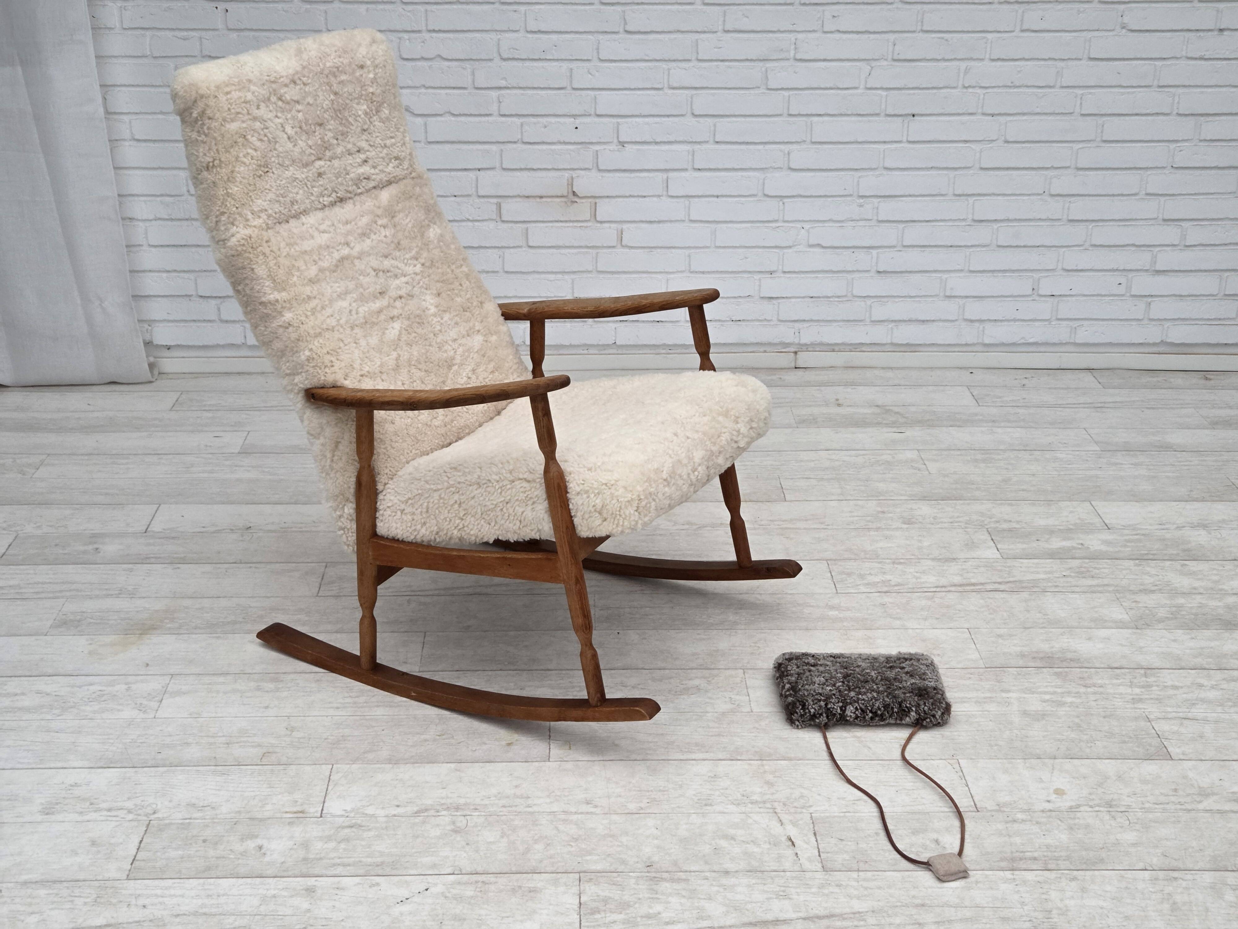 1970s, Danish rocking chair, reupholstered in quality genuine sheepskin.
