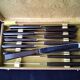 Coffret de 12 couteaux de table vintage  inox et bakélite brune