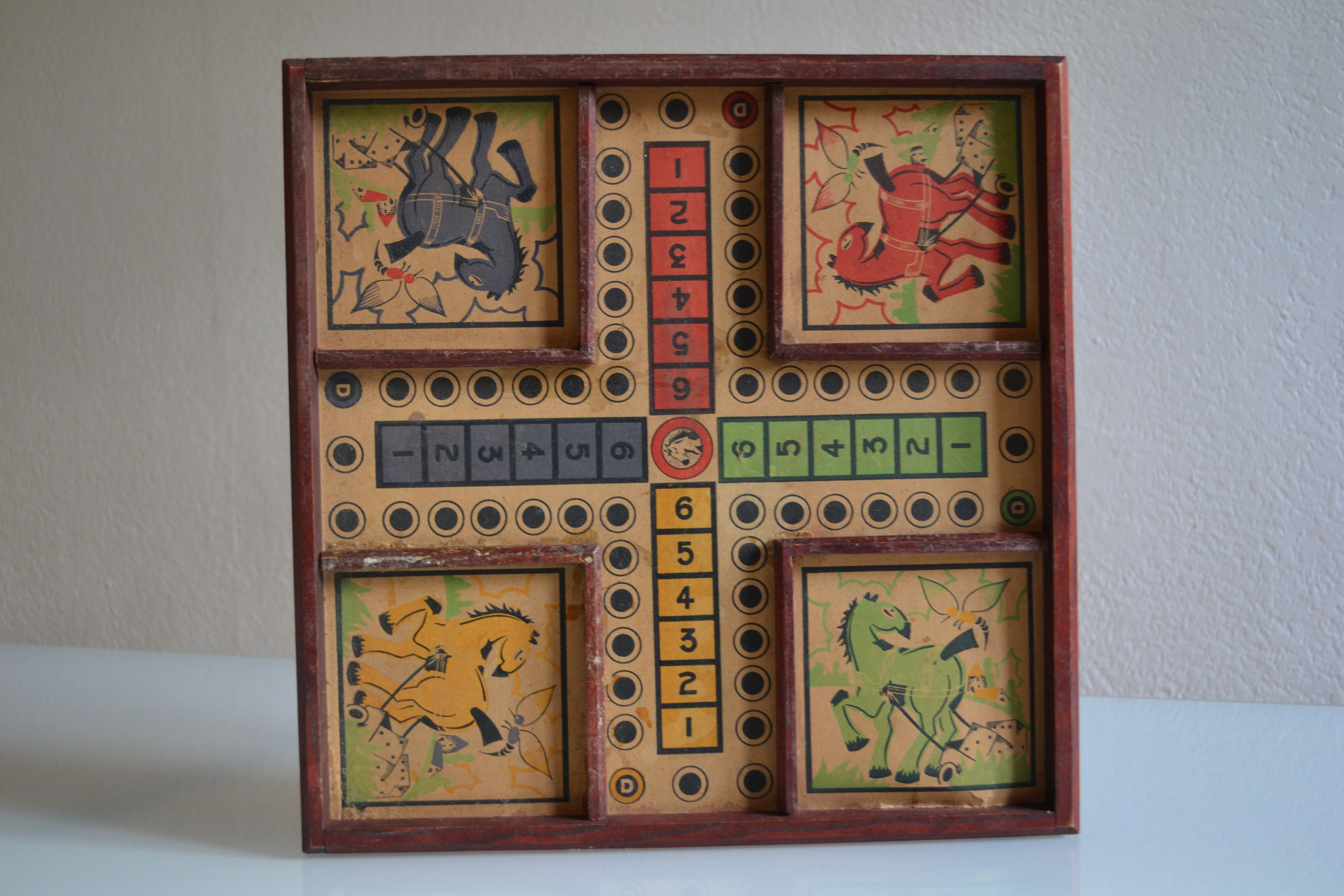 Old game board of small horses