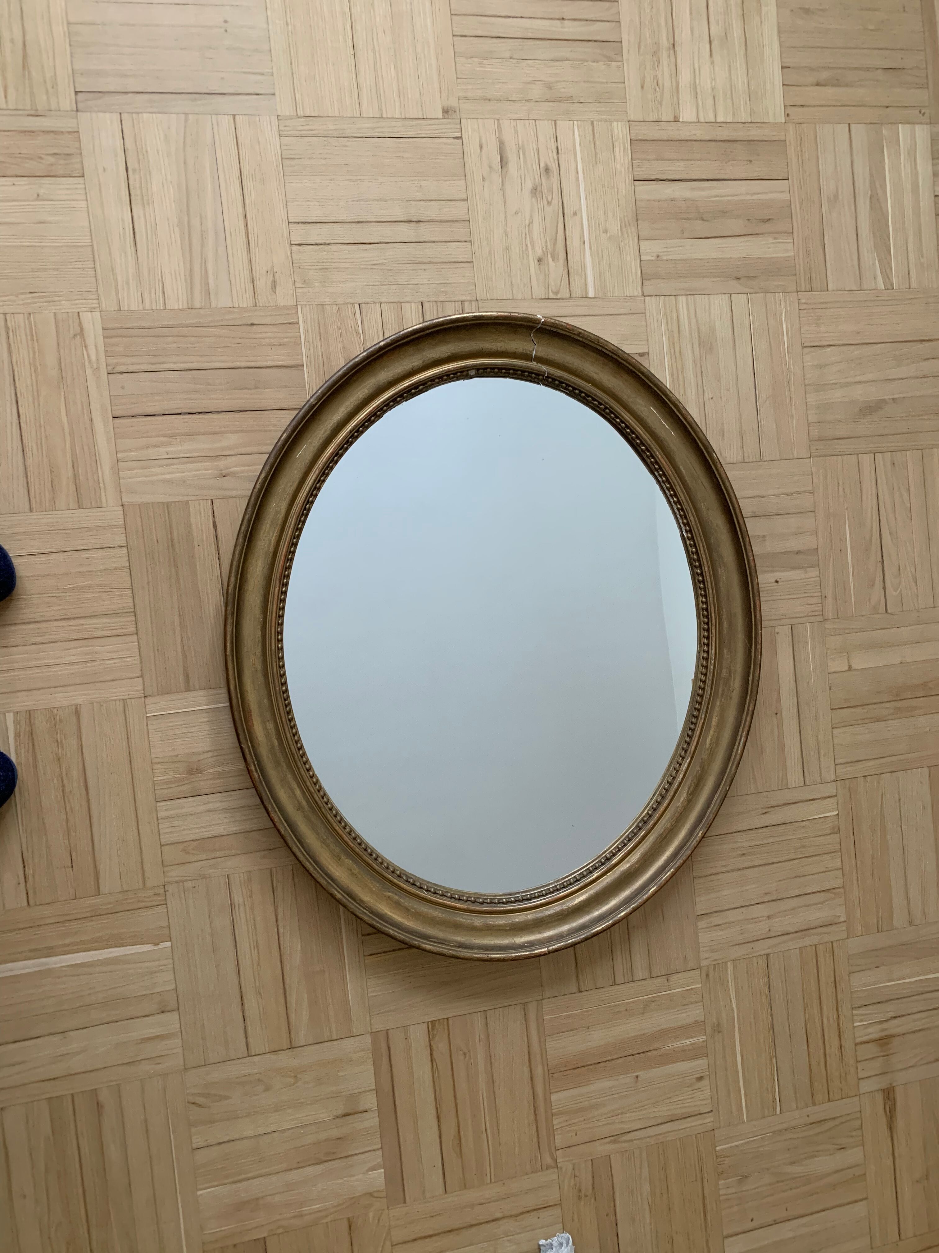 Old oval golden mirror