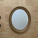 Old oval golden mirror