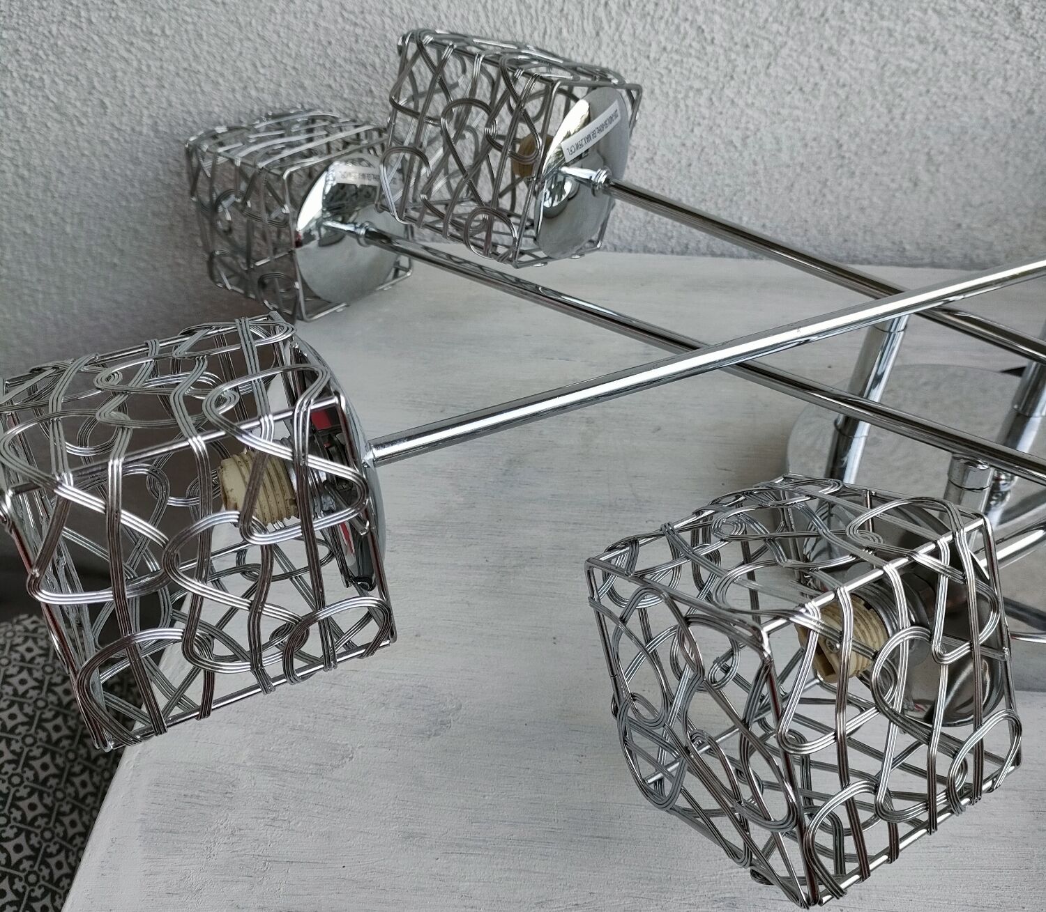 Articulated chromed metal luminaire