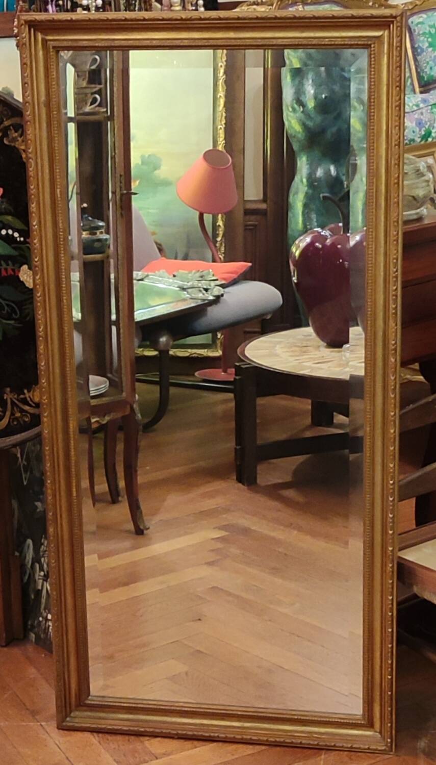 Old beveled mirror with gilded wood frame 20th century