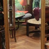 Old beveled mirror with gilded wood frame 20th century