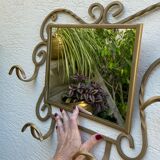 Wall-mounted gilded wrought iron coat rack with mirror