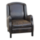 Black cow leather armchair in industrial style finished with decorative nails