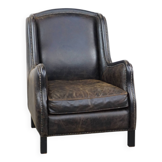 Fauteuil en cuir de vache noir de style industriel avec finition clous décoratifs