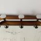 Vintage wall-mounted coat rack in chrome metal with integrated mirror and hat rack