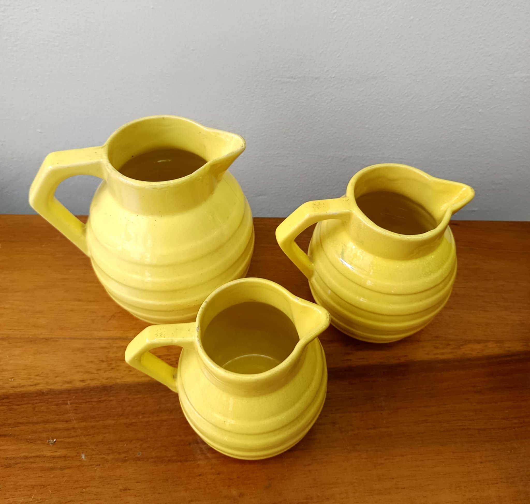 3 Orchies art deco pitchers in yellow ceramic