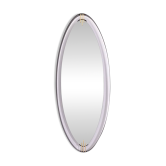 Lacquered and patinated brass mirror, ovoid shape. 1950s/60s.