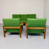 Living room sofa and Scandinavian design armchairs from the 1960s in green boucle.