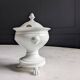 White porcelain confiturier with lion paws and masks. 19th century.