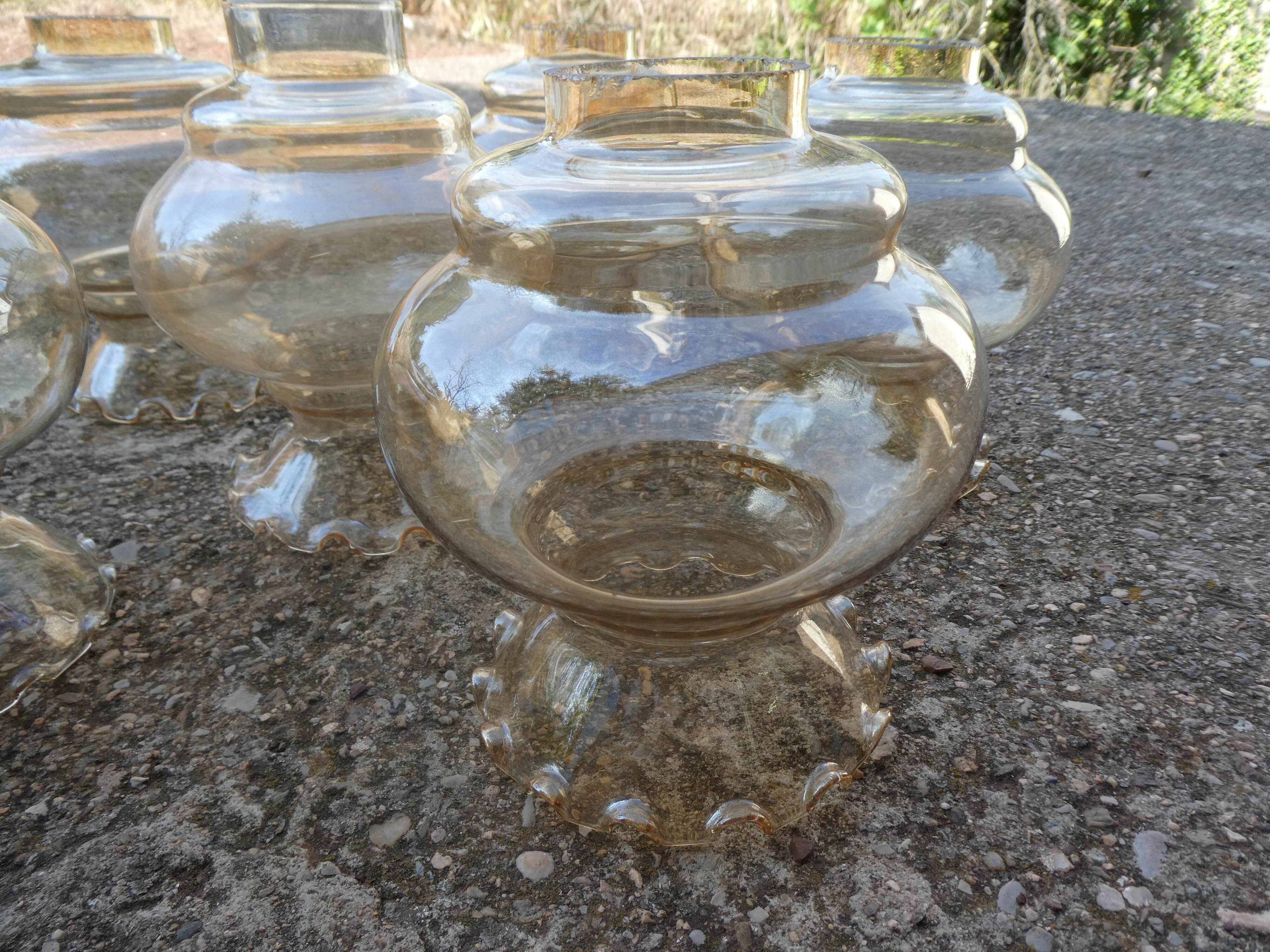 Set of 6 amber glass globes.