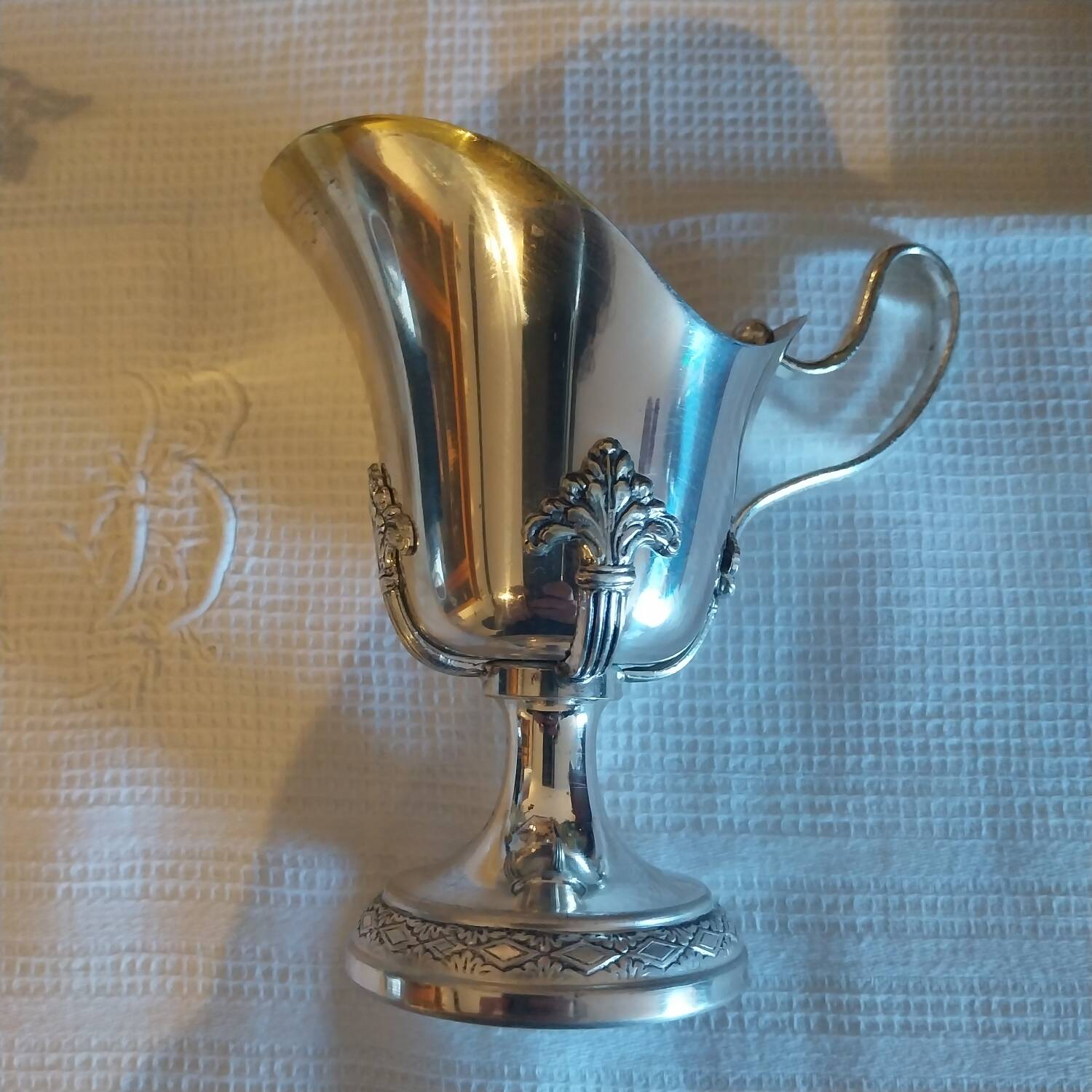 Old silver-plated milk jug