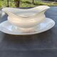 Vintage fine porcelain sauce boat with gold gilding.