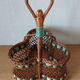 Wicker and scoubidou bottle holder